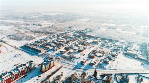 Premium Photo Top View Of The Winter Village With Snow Covered Houses