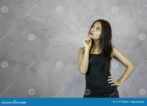 Young Pretty Woman Thinking Curious Face Questioning On Grey Background