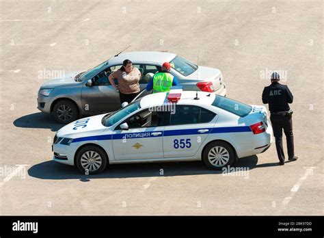 A Traffic Police Officer Stopped A Car That Violated Traffic Rules And