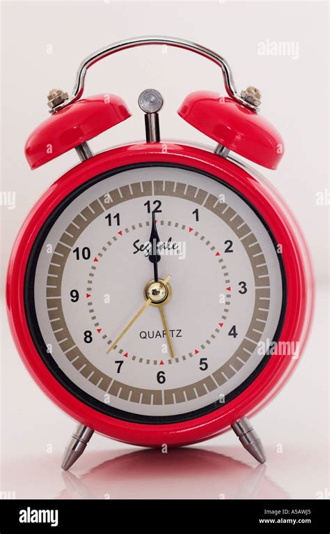 Alarm clock showing twelve o clock Stock Photo - Alamy