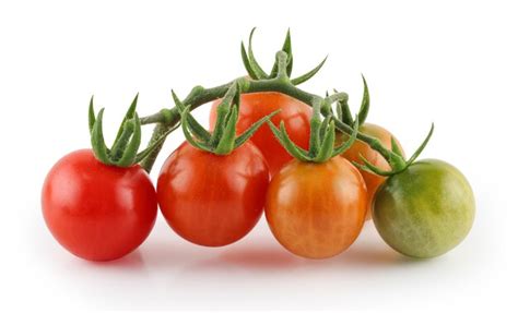 Premium Photo Bunch Of Fresh Red Cherry Tomatoes With Green Stems