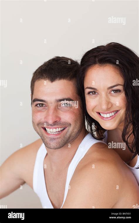 Couple hugging on a bed Stock Photo - Alamy