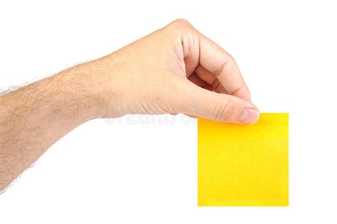 Mano Que Sostiene Un Papel De Carta O Post It Amarillo Imagen De