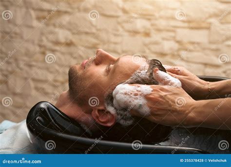 Hair Salon Master Washing Client Hair At Barber Shop Male Client