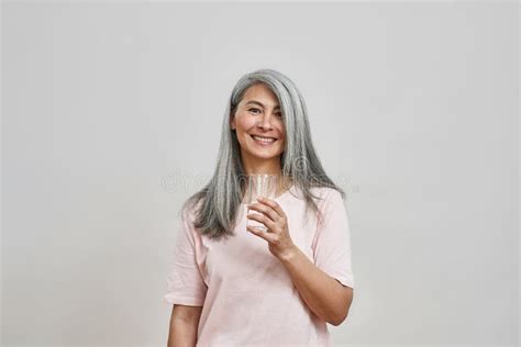 Smiling Mature Caucasian Woman With Empty Glass Stock Photo Image Of