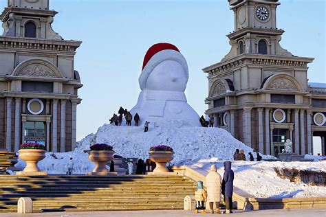 A Huge Snowman Is Being Built On The Riverbank Of Songhua River In