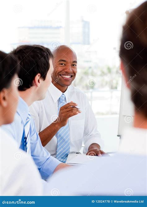 Portrait Of Smiling Business Team During A Meeting Stock Photo Image