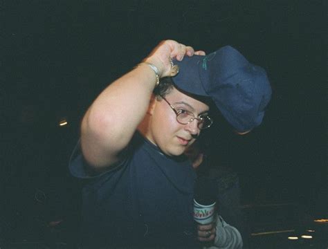 A Man With Glasses And A Hat On His Head