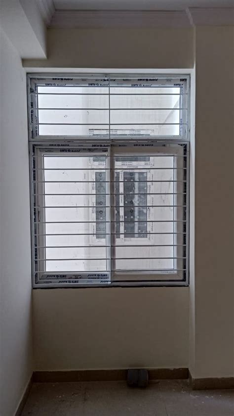 Mm Upvc Sliding Windows With Mesh With Grills At Rs Sq Ft In