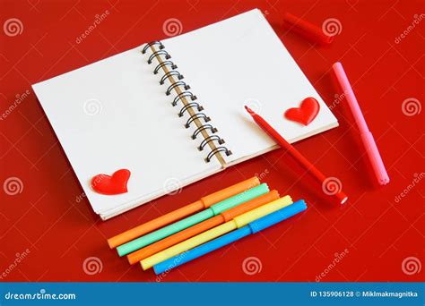 Blank Notepad With Red Hearts And Felt Tip Pens On A Red Background