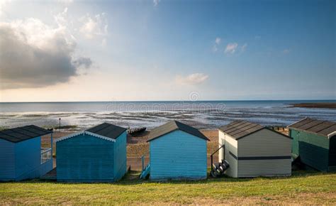 Colourful Wooden Beach Huts Facing The Ocean At Whitstable Coast Kent