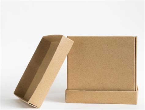 Premium Photo Close Up Of Cardboard Box Against White Background