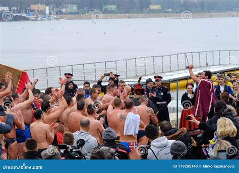 Orthodox Christians Swimming For The Holy Cross In The Icy Cold Water