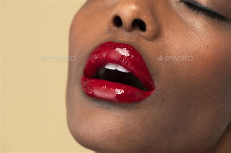 Sensual black woman wearing a glossy red lipstick Stock Photo by Rawpixel