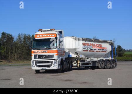 Blue White Volvo Fh Truck Of Spj Kuljetus Oy Pulls Trailer Towards