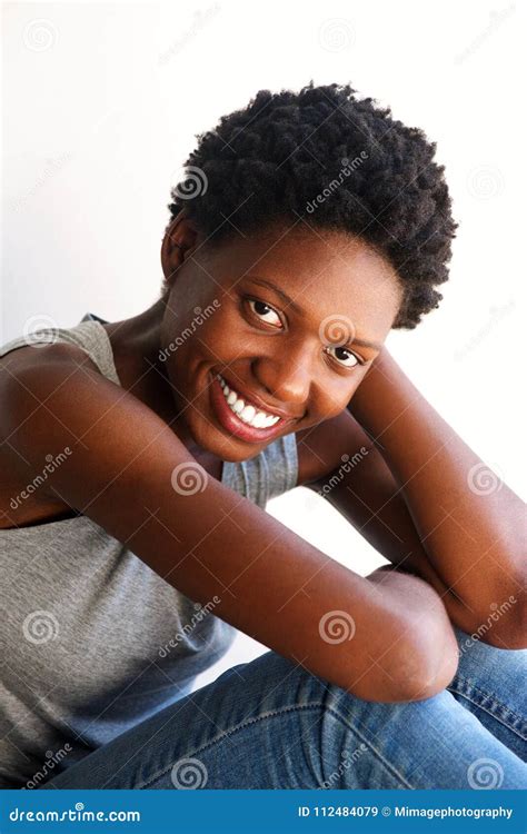 Attractive African American Woman Sitting And Smiling Stock Image