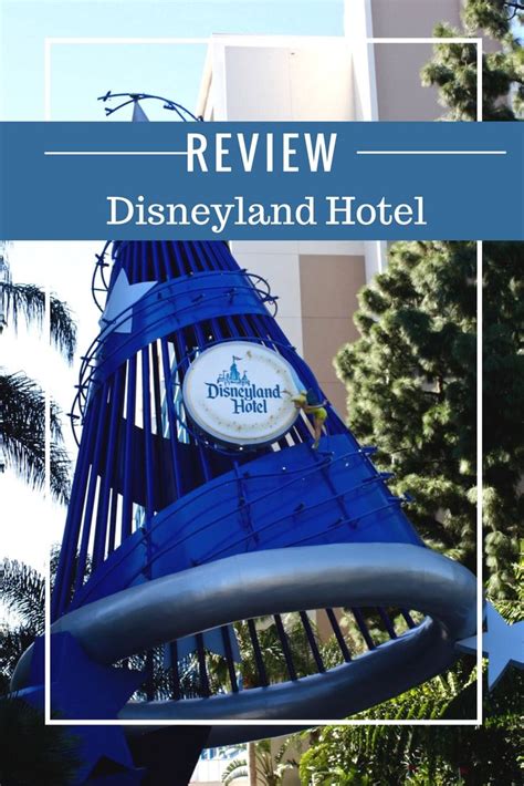 The Disneyland Hotel Sign Is Shown In Front Of Some Trees And Buildings