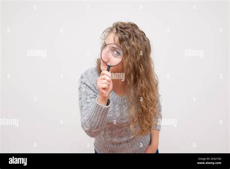 Woman Look Through Magnifying Glass And Smile Stock Photo Alamy