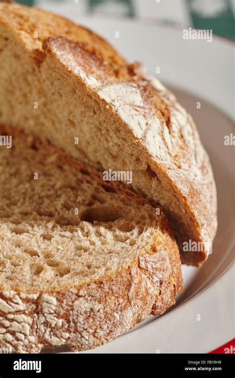 Sliced Loaf Of Artisan Whole Grain Bread Stock Photo Alamy