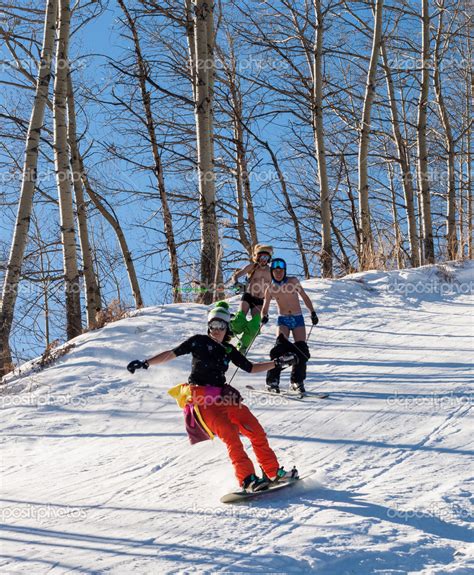 Skiing And Snowboarding In Style Hippie Naked Stock Photo