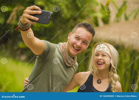 Young Happy And Beautiful Hipster Couple Taking Selfie Picture With