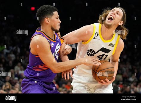 Utah Jazz Forward Kelly Olynyk Gets Fouled By Phoenix Suns Guard