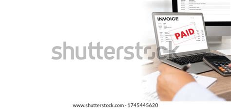 Businessman Work Using Computer Calculating Invoice Stock Photo