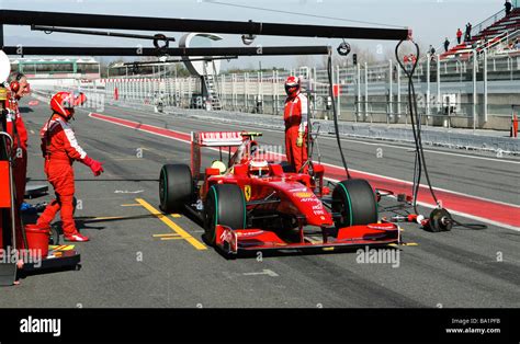 Kimi Raeikkoenen In The Ferrari F Car Making A Pit Stop During