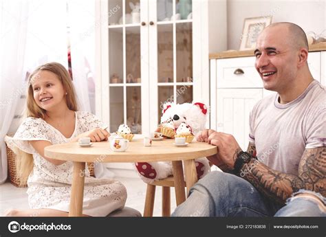 Adorable Daughter Wearing A White Dress Whith Her Loving Father They