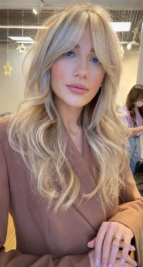 50 Cute Hairstyles With Curtain Bangs Beige Blonde Layered Cut With Bangs