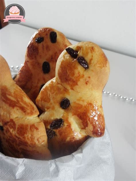 Some Breads Are In A Bowl On A White Tablecloth With A Beaded Necklace