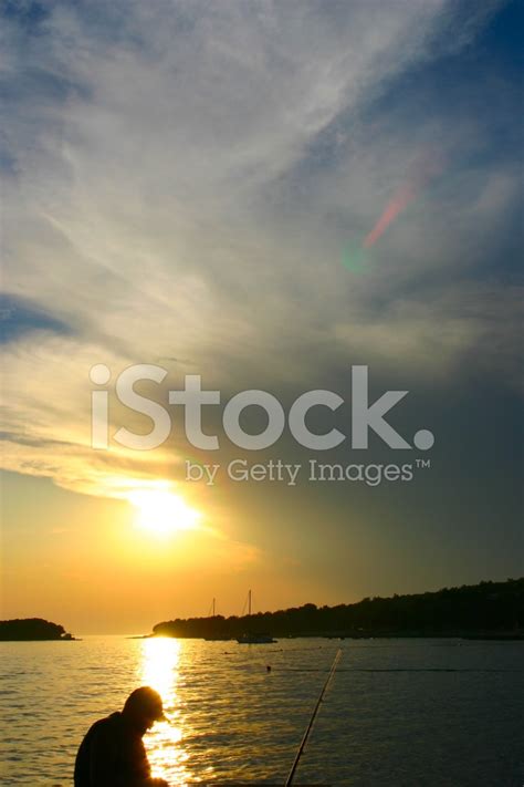 Sunset With Fisherman Stock Photo | Royalty-Free | FreeImages