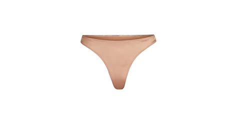 Skims Stretch Satin Thong In Desert Clay Kim Kardashian Skims Stretch Satin Collection