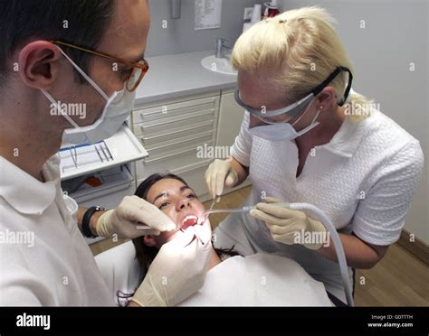 Dentist Treating A Patient Stock Photo Alamy