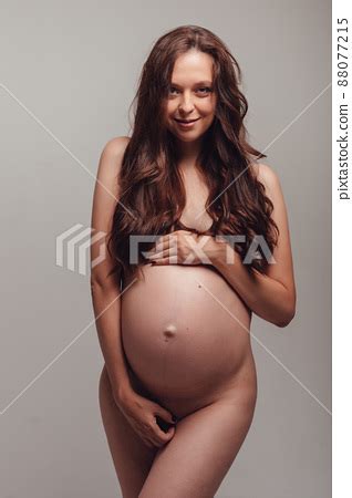 A Beautiful Slender Naked Pregnant Woman Stock Photo