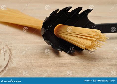 A Portion Of Spaghetti Measured In A Spoon Stock Image Image Of