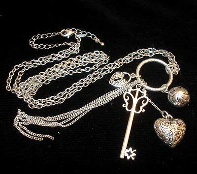 Long Avon Silver Tone Necklace Key Puffed Heart Chain Charms Etc