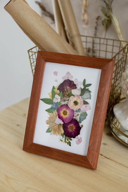 Premium Photo Picture Of Dried Flowers In A Wooden Frame On The Desktop In The Interior