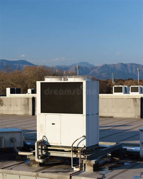 A Row Of Air Conditioning Units On A Rooftop Stock Photo Image Of