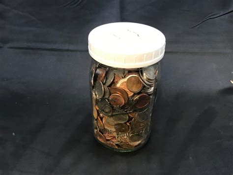 JAR OF COINS | EstateSales.org