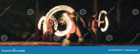 Luau Party Polynesian Fire Dancers Throwing Fire Torches At Night On