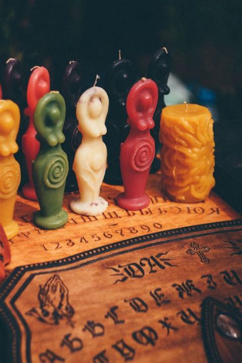 Small Candles Sitting On Top Of A Wooden Table