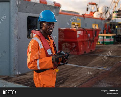 Seaman Ab Or Bosun On Deck Of Offshore Vessel Or Ship Wearing Ppe Personal Protective