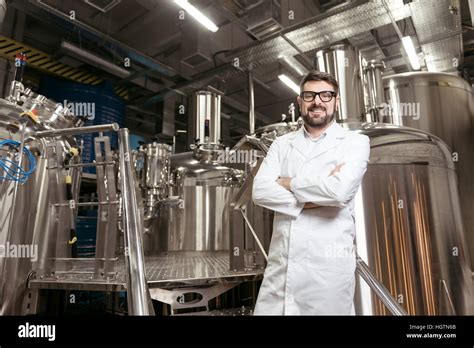 Joyful Man Posing With Brewing Mechanisms Stock Photo Alamy