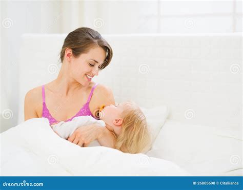 Happy Young Mother Holding Sleeping Baby Stock Photo Image Of Mommy