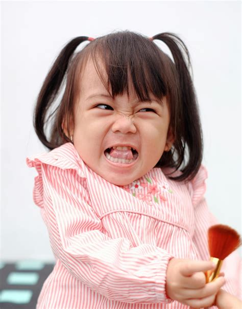 Photo Of Kid Sitting On A Chair · Free Stock Photo