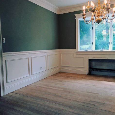 Empty Room With Chandelier And Fireplace In The Corner Surrounded By