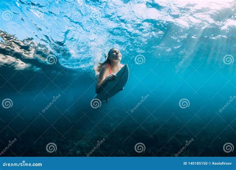 Young Surf Girl At Surfboard Underwater In Sea Stock Photo Image Of