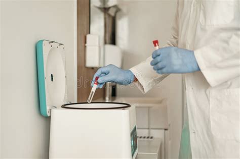 Close Up Of Scientist X27 S Hand In Gloves Putting A Small Plastic