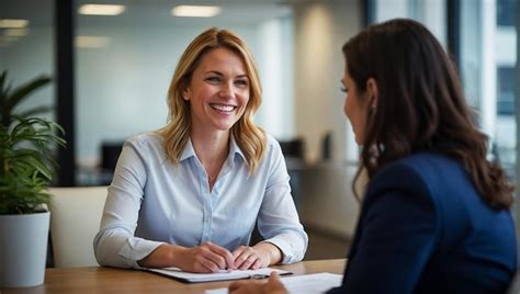 Premium Photo Smiling Female Manager Interviewing An Applicant In Office